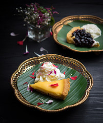Piece of tasty lemon pie on wooden table