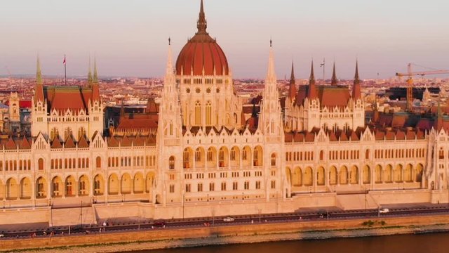 Aerial view of Hungarian Parliament from the Danube river at sunset, Budapest, Hungary