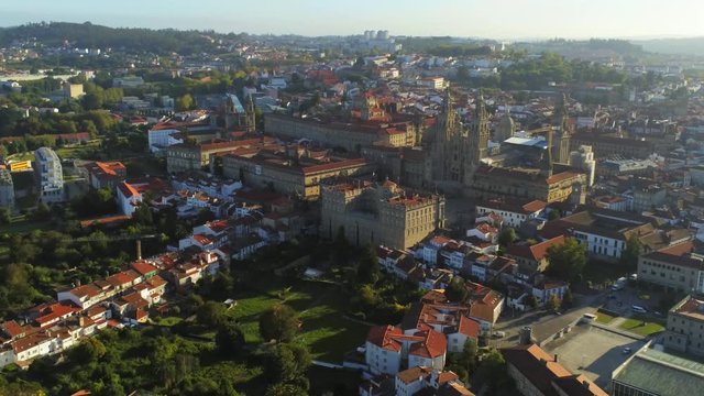 Aerial, drone shot of the Cathedral of Santiago de Compostela, in Downtown Saint James of Compostella, sunny evening, in Galicia, Spain - Zoom view