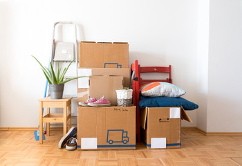 Fototapeta premium Move. Cardboard boxes, cleaning things and stuff for moving into a new, clean and bright home