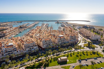 Obraz premium Aerial view of the coastline and harbour of Almerimar Spain on a sunny day