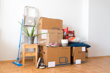 Move. Cardboard boxes, cleaning things and stuff for moving into a new, clean and bright home - obrazy, fototapety, plakaty