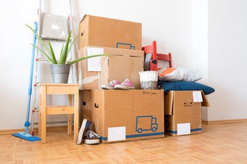 Move. Cardboard boxes, cleaning things and stuff for moving into a new, clean and bright home