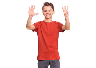 Portrait of happy teen boy showing two palms - 8 fingers, isolated on white background. Happy smiling child doing gesture of number Eight. Series of photos count from 1 to 10.