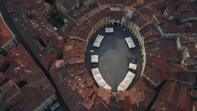 Aerial tracking shot of amphitheater square in lucca tuscany Italy europe
