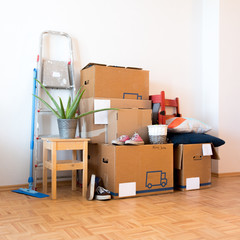 Move. Cardboard boxes, cleaning things and stuff for moving into a new, clean and bright home