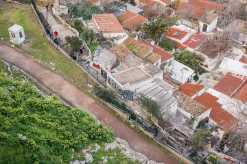 Fototapeta premium Aerial view of preserved historic buildings in the Plaka neighborhood of Athens, on the slopes of Acropolis, Greece