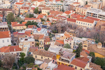 Fototapeta na wymiar Aerial view of preserved historic buildings in the Plaka neighborhood of Athens, on the slopes of Acropolis, Greece