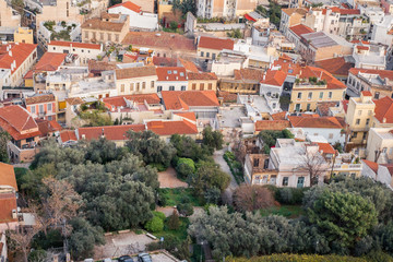 Obraz premium Aerial view of preserved historic buildings in the Plaka neighborhood of Athens, on the slopes of Acropolis, Greece