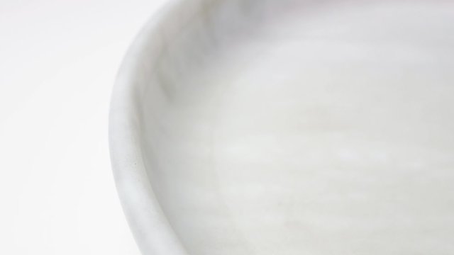 Three colored marble balls rolling on white surface, Abstract Loop