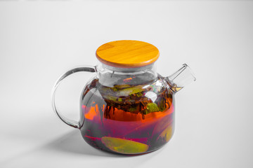fruit tea in a transparent teapot. breakfast