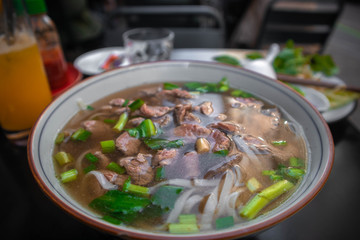 Pho Bo, traditional Vietnamese noodle soup with beef. The famous street food recipe of Vietnam. 