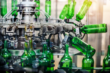 Bottling and conveyor line or belt at winery factory, Wine bottles filling production.