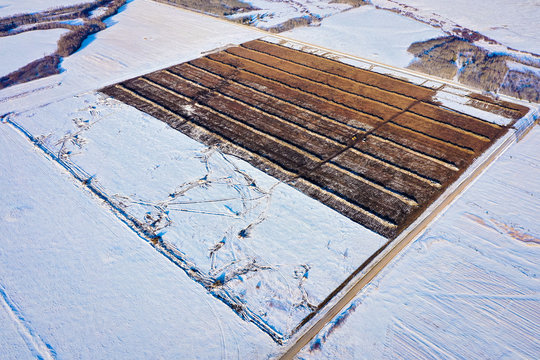 Aerial Shot Of Perfectly Straight Lines Made By Bull Dozers Clearing Bush.