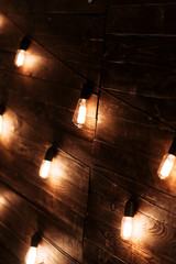 Evening wedding ceremony with garlands of lamps