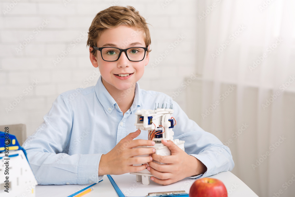 Poster innovation concept. smart boy showing robot at lesson