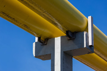Yellow engineering pipeline against the sky