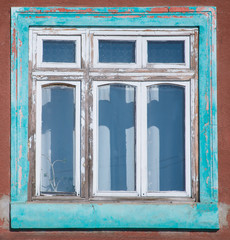 Old house with wooden window frames exterior