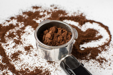 Ground coffee on a white background