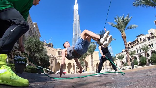 Group of acrobats jumping with double jump rope in Dubai doing different tricks in slow motion