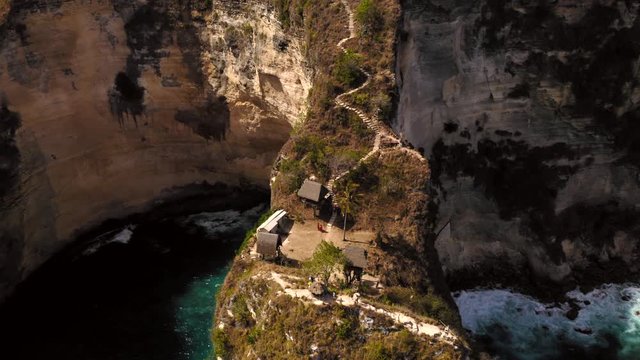 Aerial drone flight over Atuh cliff with huge stairs, Nusa Penida, Bali, Indonesia, 4k
