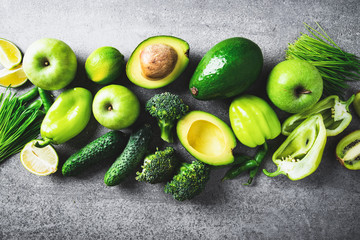 Fresh fruit, vegetable, greens on gray concrete background. Green healthy food, clean eating. Detox, dieting food.	