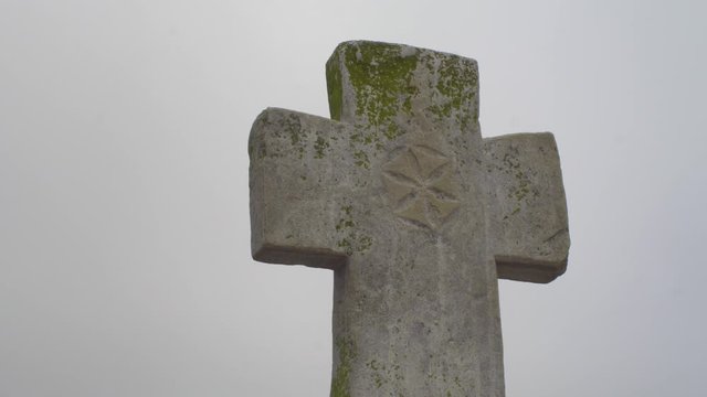 Jib up to stone cross at Orhei Vechi outside the monastery, Moldova.