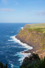 Fototapeta na wymiar Cliffs and Atlantic ocean view from the observation deck Vigia das Baleias, Terceira.