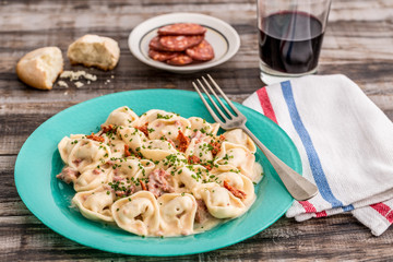 Four cheese capellettis with potato cream and sausage