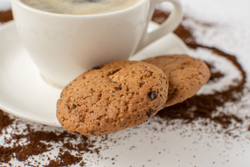 Espresso coffee on a white background with cookies. Still-life. Selective focus.