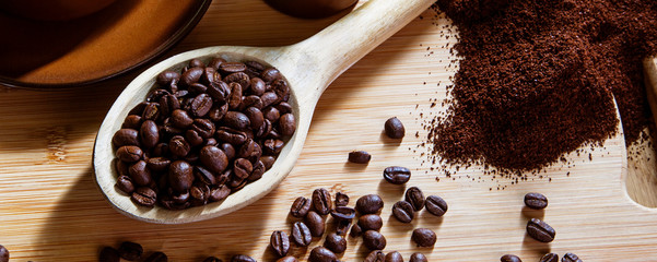 Coffee beans - concept for enjoying the taste & flavors of real coffee -  panorama /  header / banner.