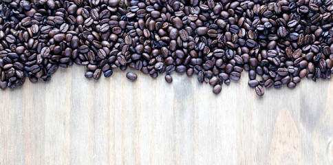 Coffee beans - for inspirational concepts & ideas - panorama header / banner on a natural, rustic, background texture, with design space.