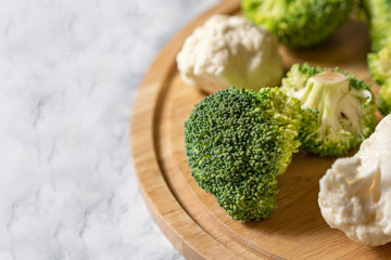 Healthy green organic raw broccoli and cauliflower