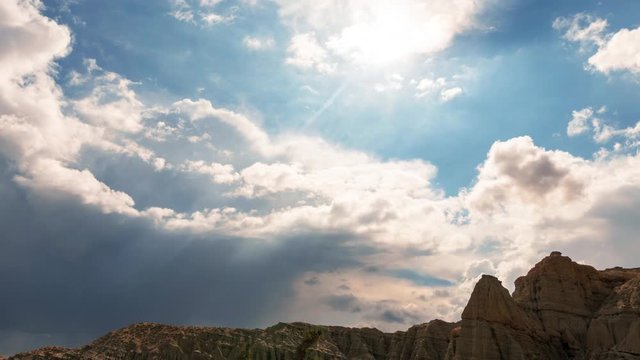 Time Lapse Storm Clouds Cover the Sun Beams in the Redrock Canyon