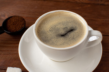 Espresso coffee on a wooden background. Still-life. Selective focus.