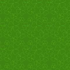 Seamless background from the leaves of the clover. St.Patrick 's Day