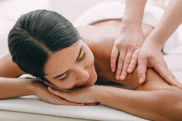 Obraz na płótnie Canvas Beautiful woman enjoying massage at the spa.