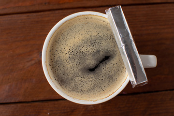 Espresso coffee on a wooden background with mini chocolates still Life . Selective focus.