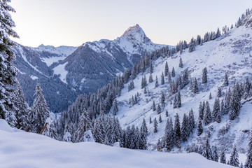 Fototapeta na wymiar Winter in the Austrian Alps, View of Grosser Rettenstein Mountain in the morning light of a winterday