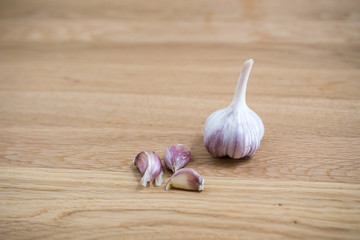 fresh organic bulb of garlic on a wooden desk