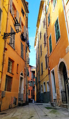 Fototapeta na wymiar view of houses on a narrow street in the Italian style in Nice, France