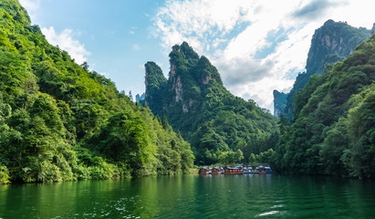 Small Chinese town that lives isolated inside the lake with houseboats. Baofeng Lake (Bao Feng Hu) in Suoxi Valley, Wulingyuan, China
