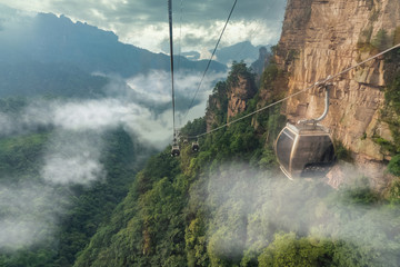 Cable crossing Tianzi Mountain and Yellow Stone Stronghold (Huangshi Zhai) in Yuanjiajie Scenic Area , Zhangjiajie National Park, China