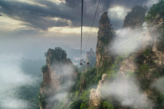 Cable crossing giant pillar mountains in Tianzi Mountain and Yellow Stone Stronghold (Huangshi Zhai), Zhangjiajie National Park, China