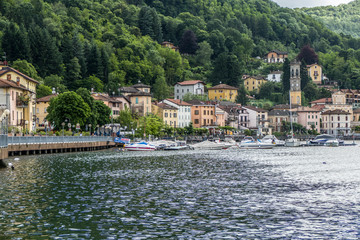 Lakefront of Porto Ceresio with flowers and colored houses