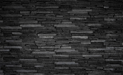 Texture of black brick slate wall, dark grey stone background