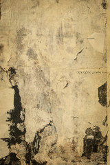 Obraz premium old cracked bulletin board wall with rests of paper