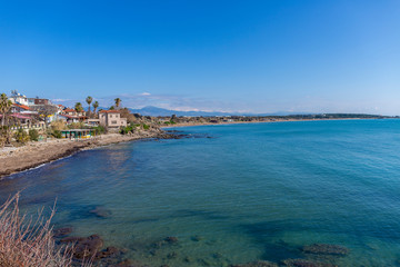 Blue sea at a beautiful beach with blue sky