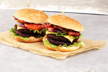 Tasty fresh meat burgers with salad and cheese. Homemade angus burger.