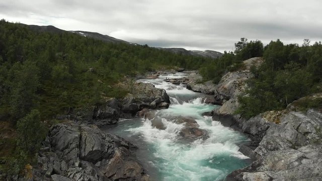 Beautiful wild river called Otta in Norway.
Filmed with a drone standing still.